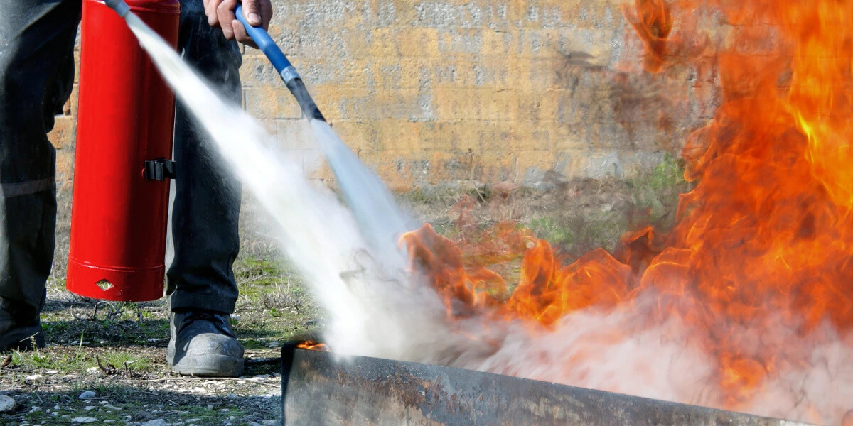 Extinguishing a fire using abc dry chemical powder extinguisher